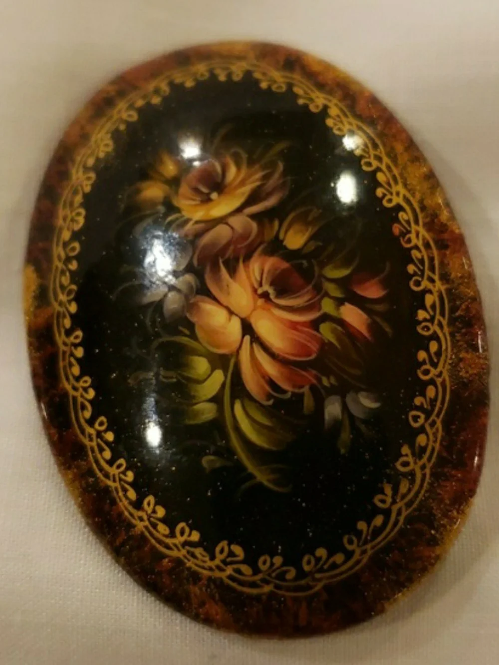Vintage '96 Oval Black Floral Brooch with Gold Accents
